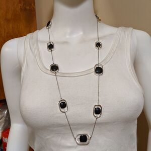 Black moving beads on a silvertone frame necklace